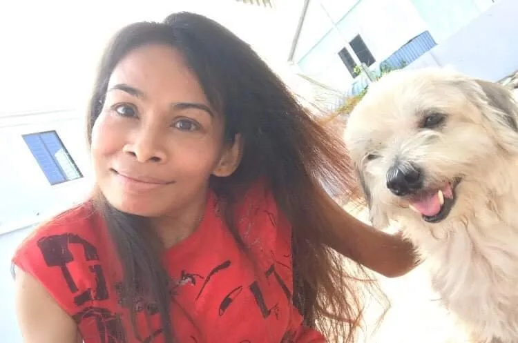 Naleng Real with her dog at the new accommodation