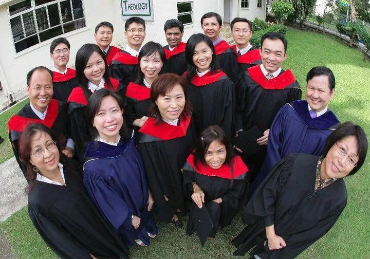 Naleng Real with her graduating class in academic robes outside the East Asia School of Theology